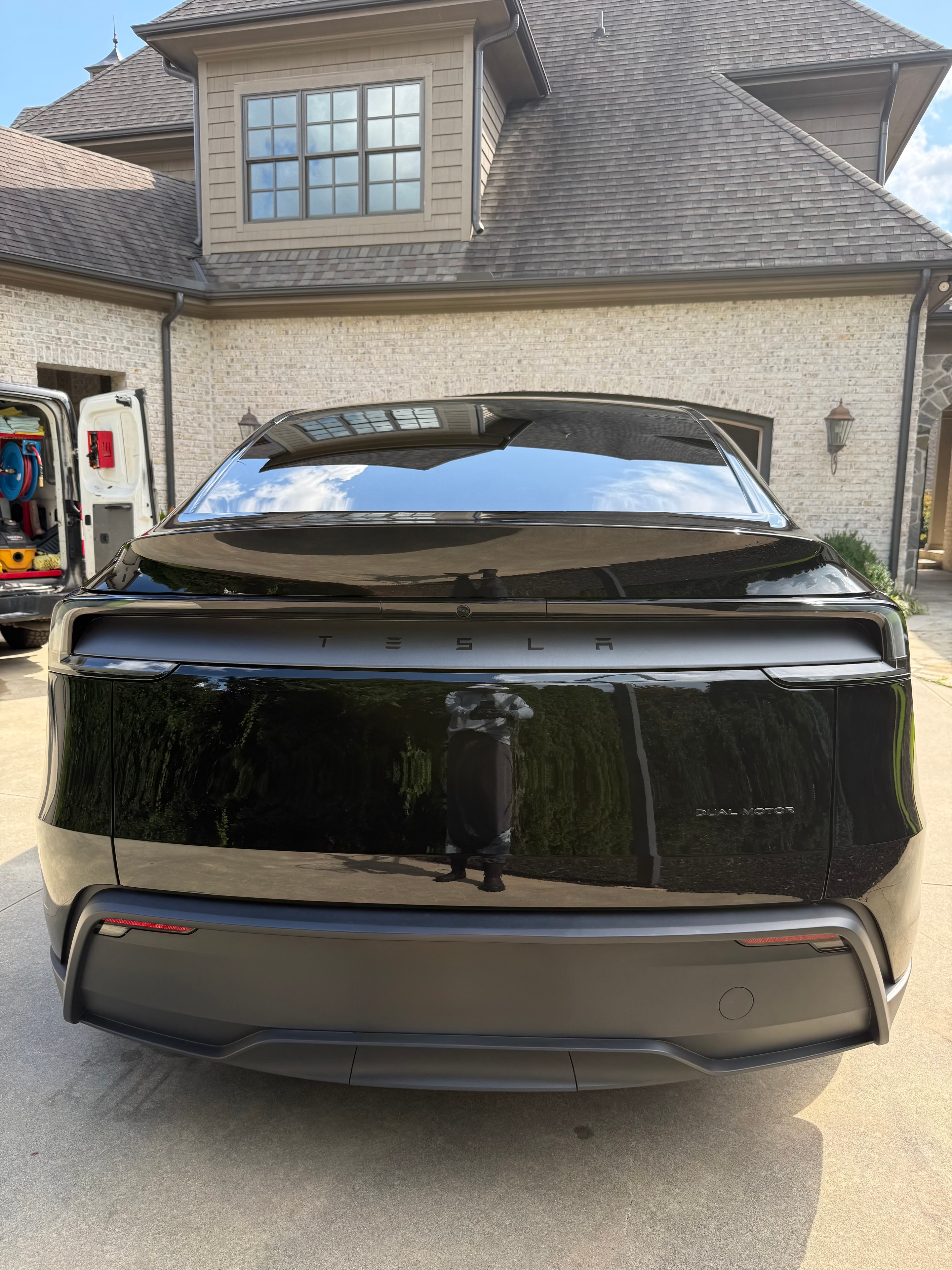 Tesla Model 3 rear view with mirror-like paint finish after detailing