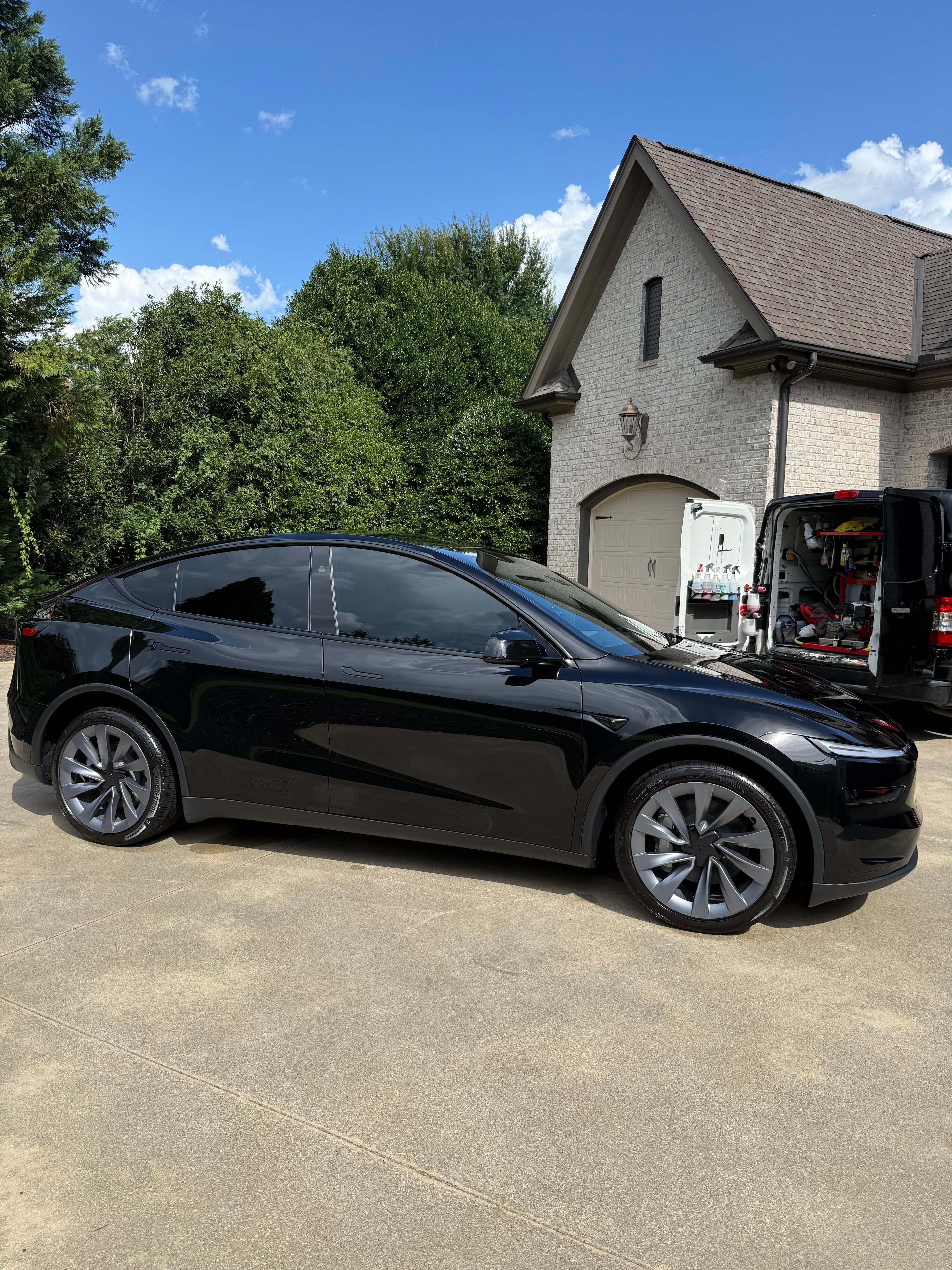 Tesla side profile with deep gloss black paint after mobile detailing